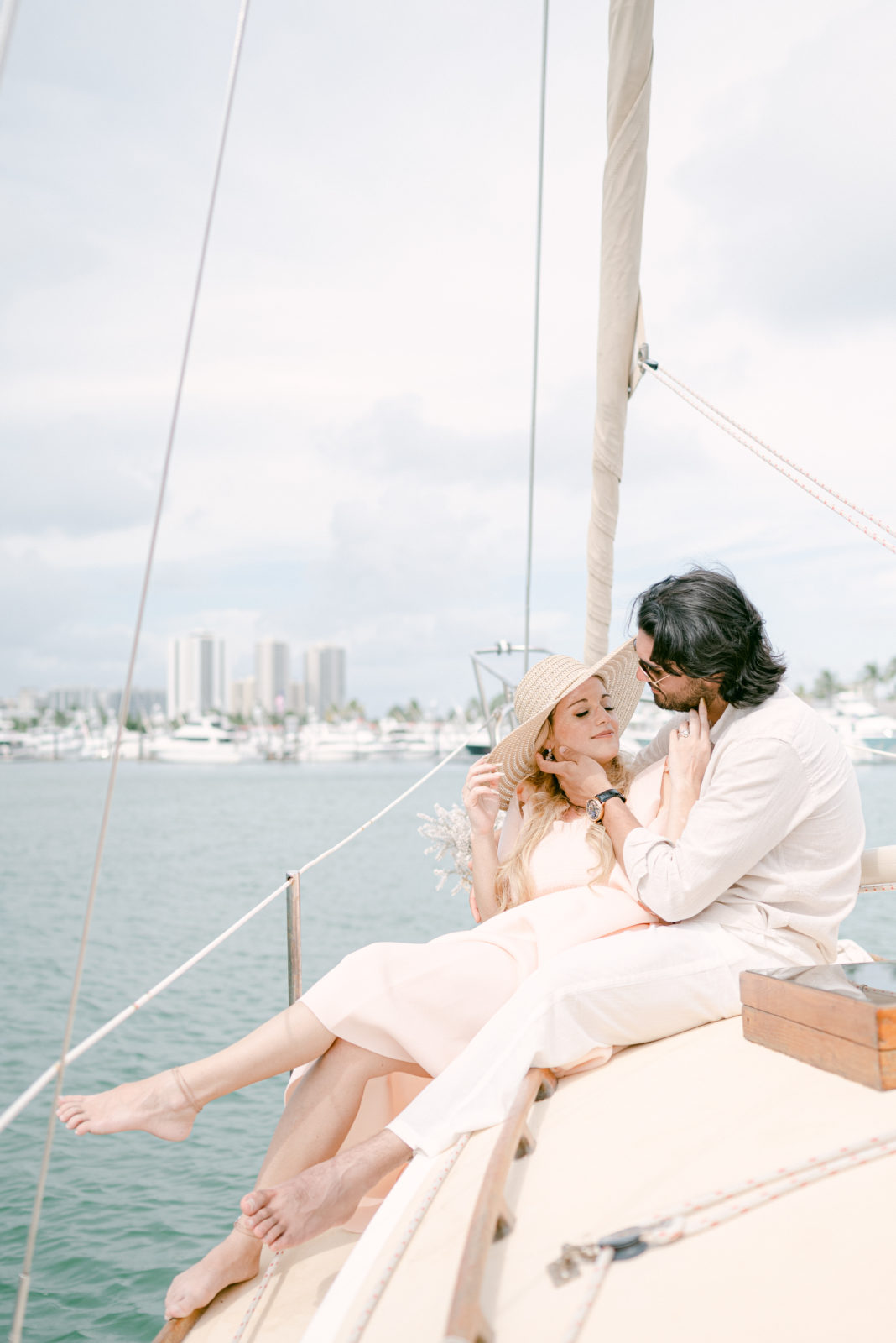 Newly engaged couple on a sailboat in South Florida