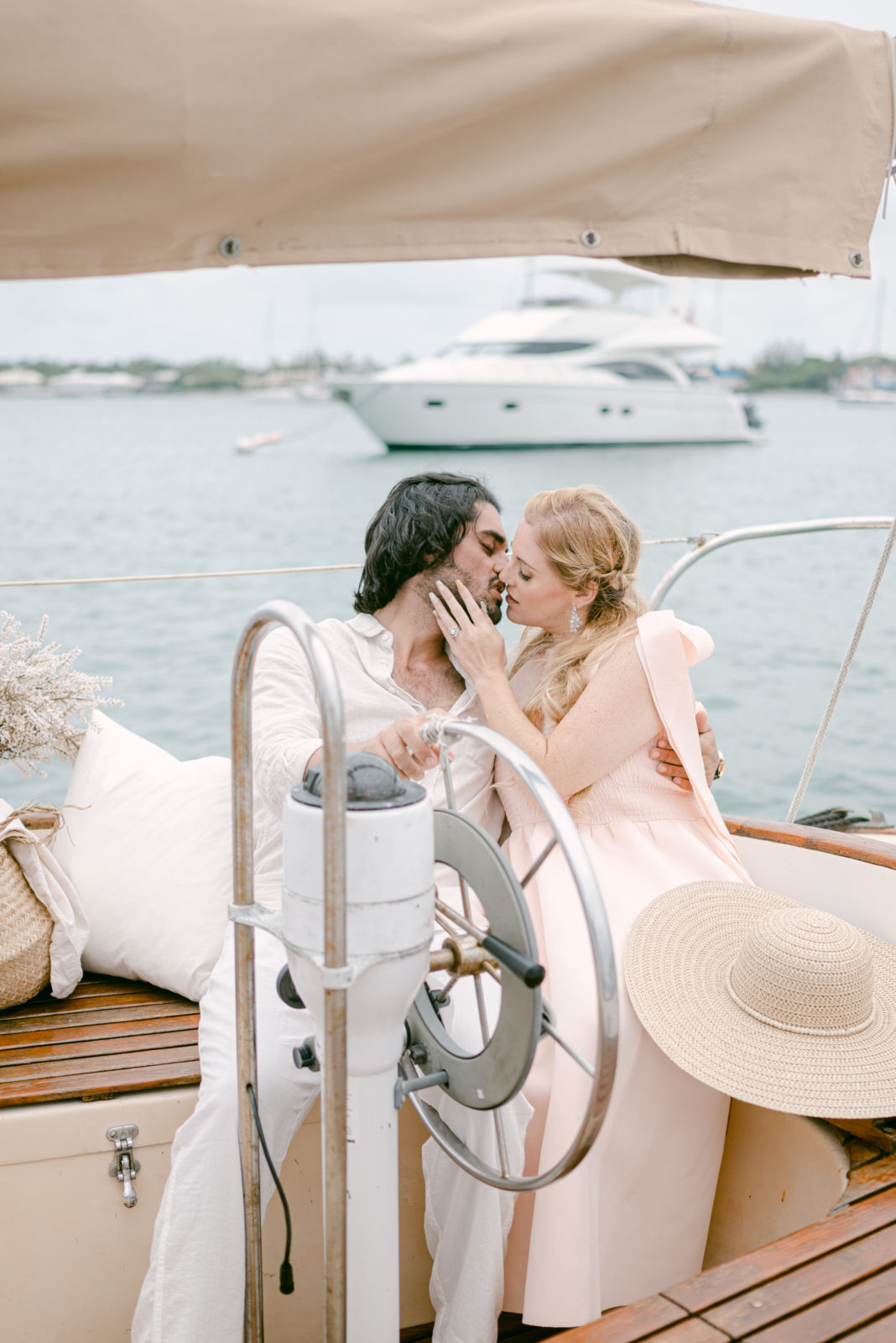 Couple kissing while driving a boat