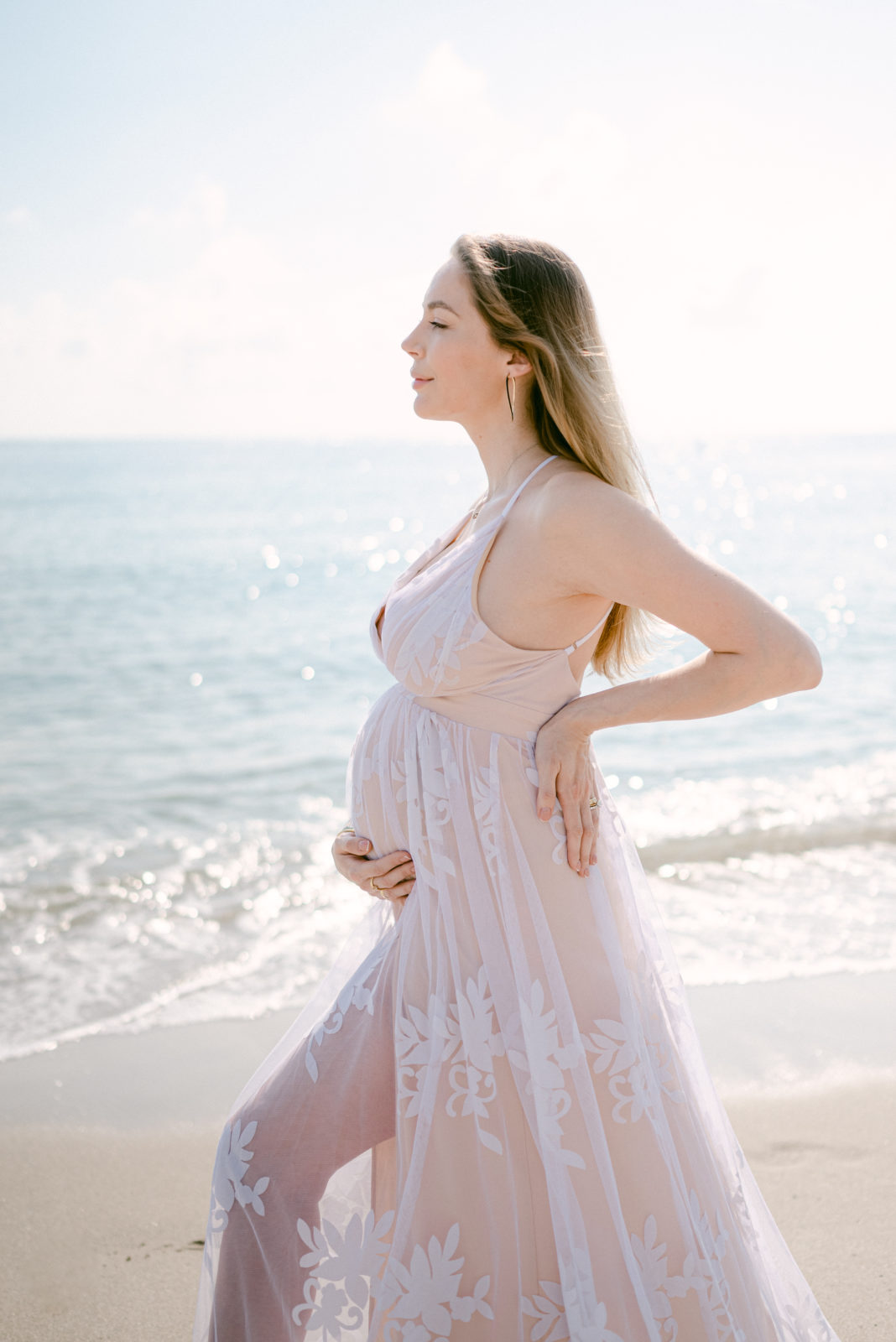 Beach pregnancy photo mom to be looking straight