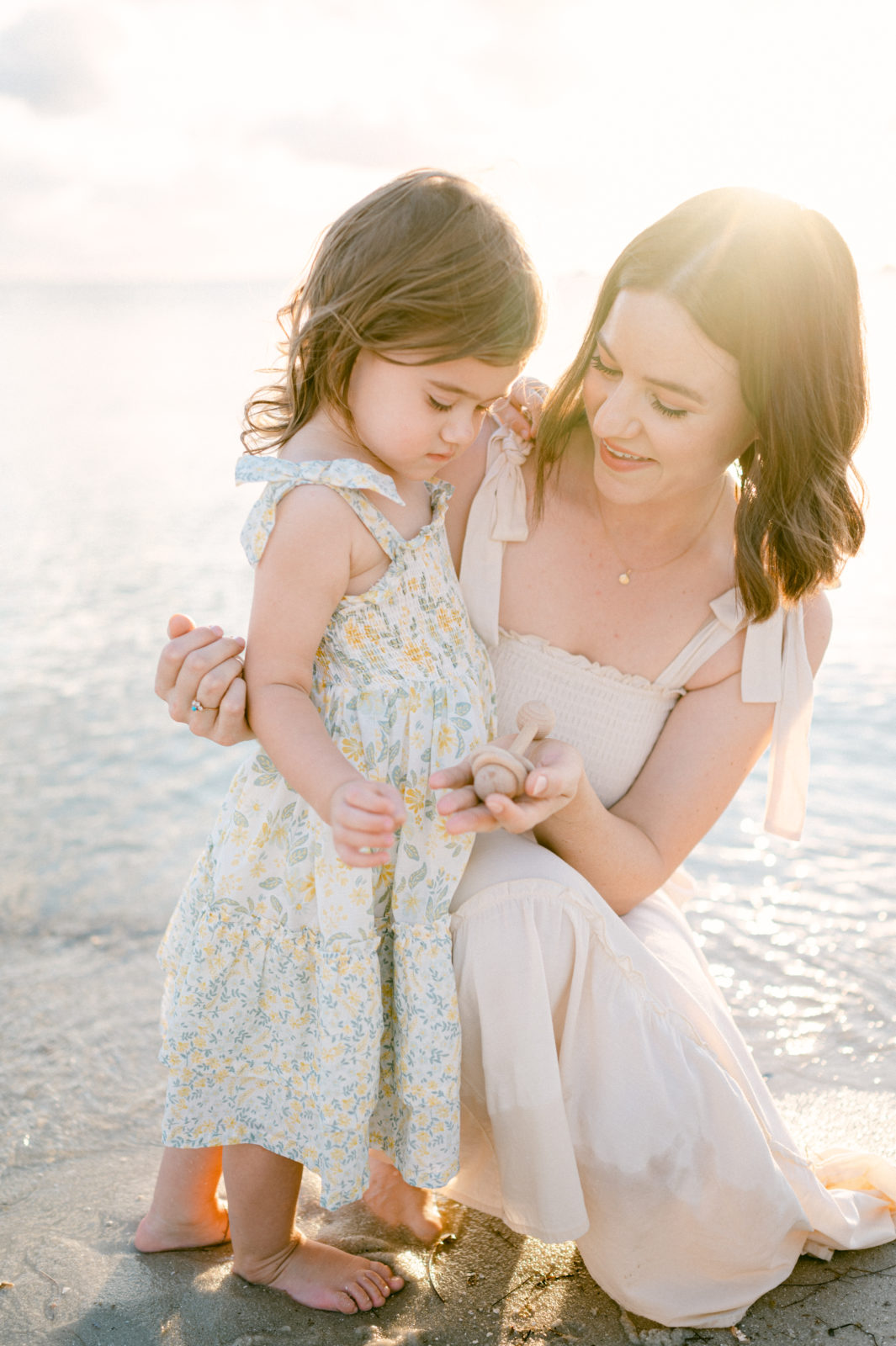 Mom looking at her daughter at sunset by South Florida Family Photographer