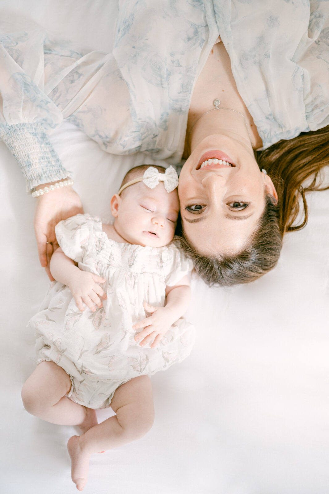 Mom and baby upside down during Miami newborn photos