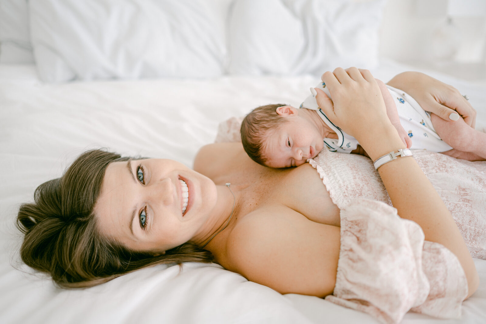 Newborn on mommy's chest during their Miami newborn session