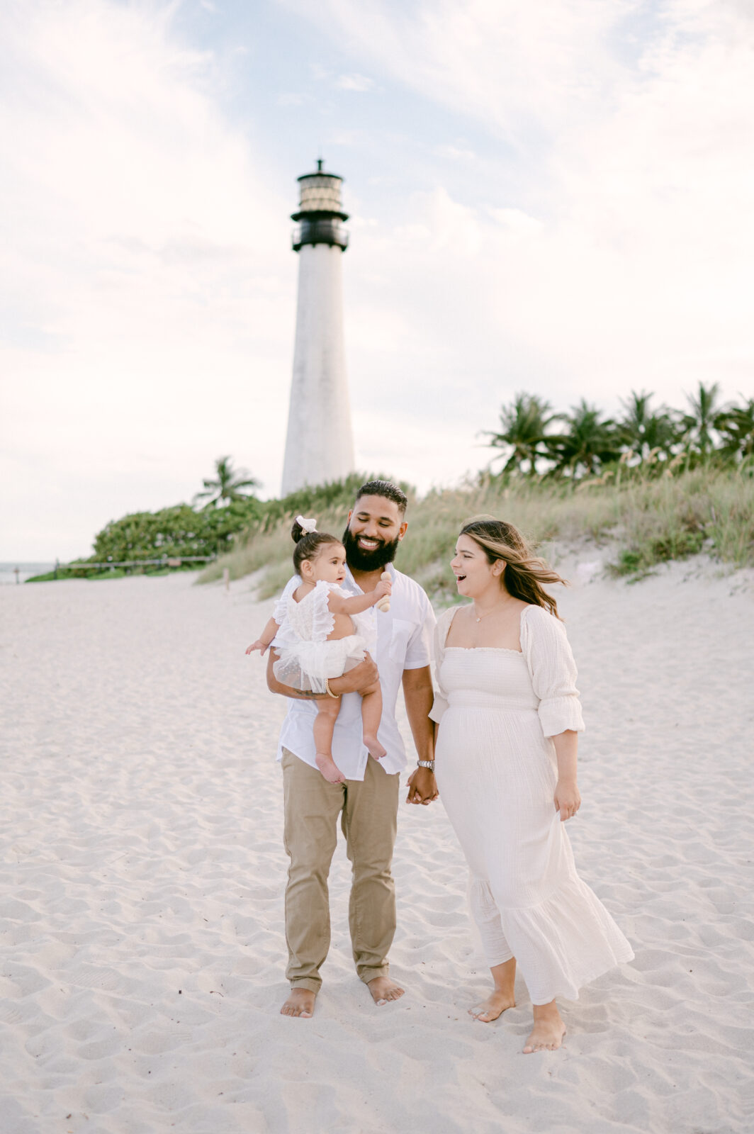 Family walking hands in hands at the lighthouse in Key Biscayne
