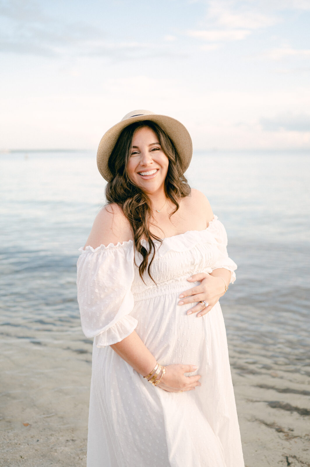 Portrait of a pregnant mama laughing in Miami Beach