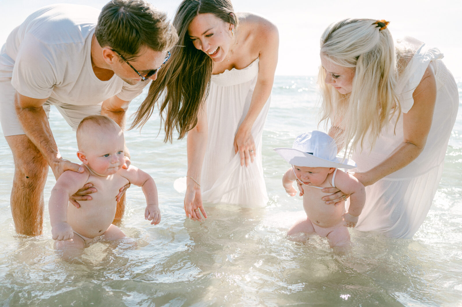 Family playing in the water with their babies in Miami