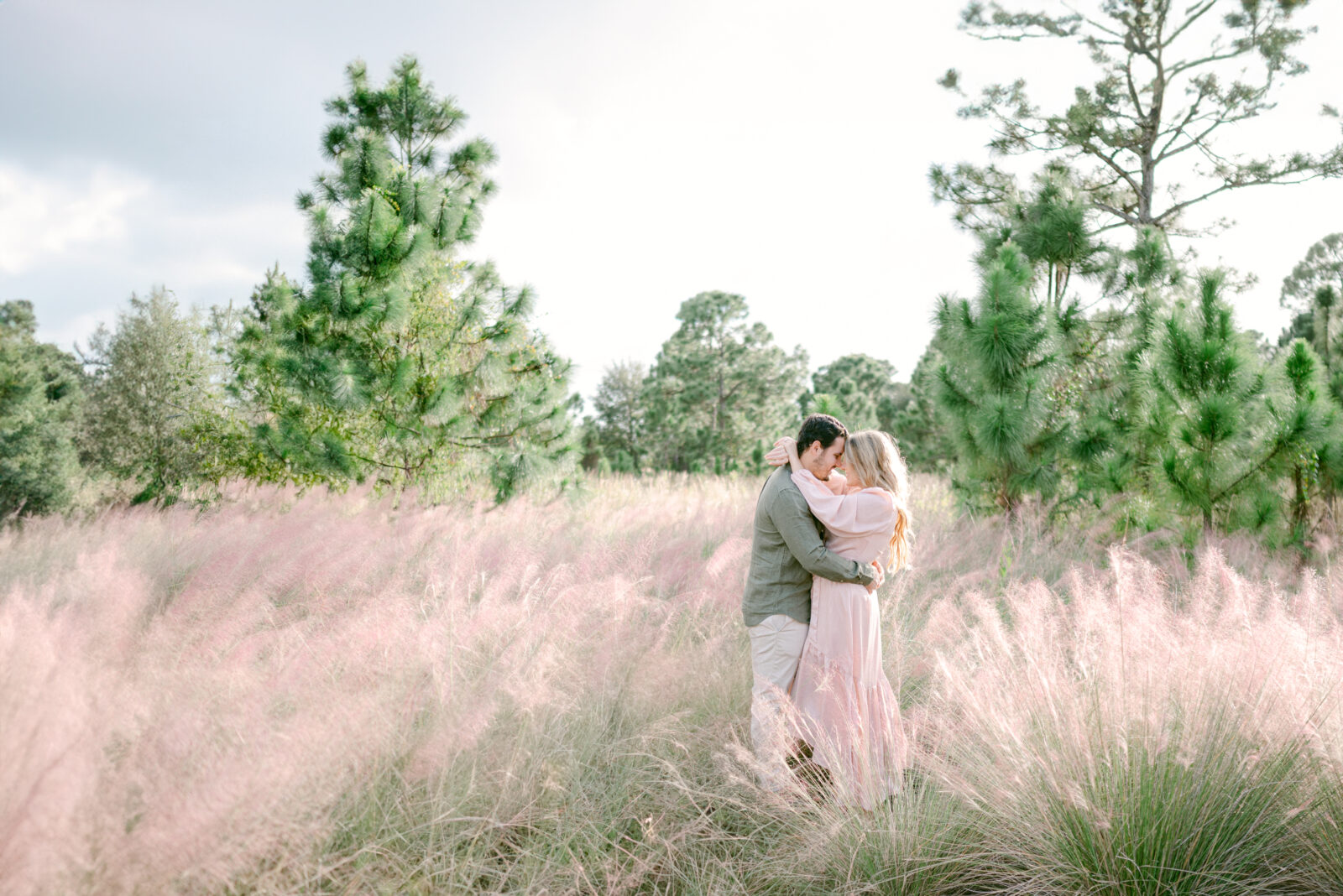 Miami maternity session in a pink field