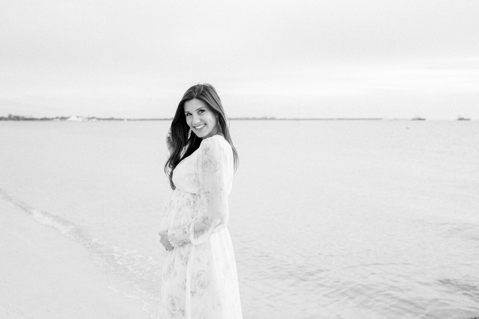 Black and white pregnancy photos on the beach