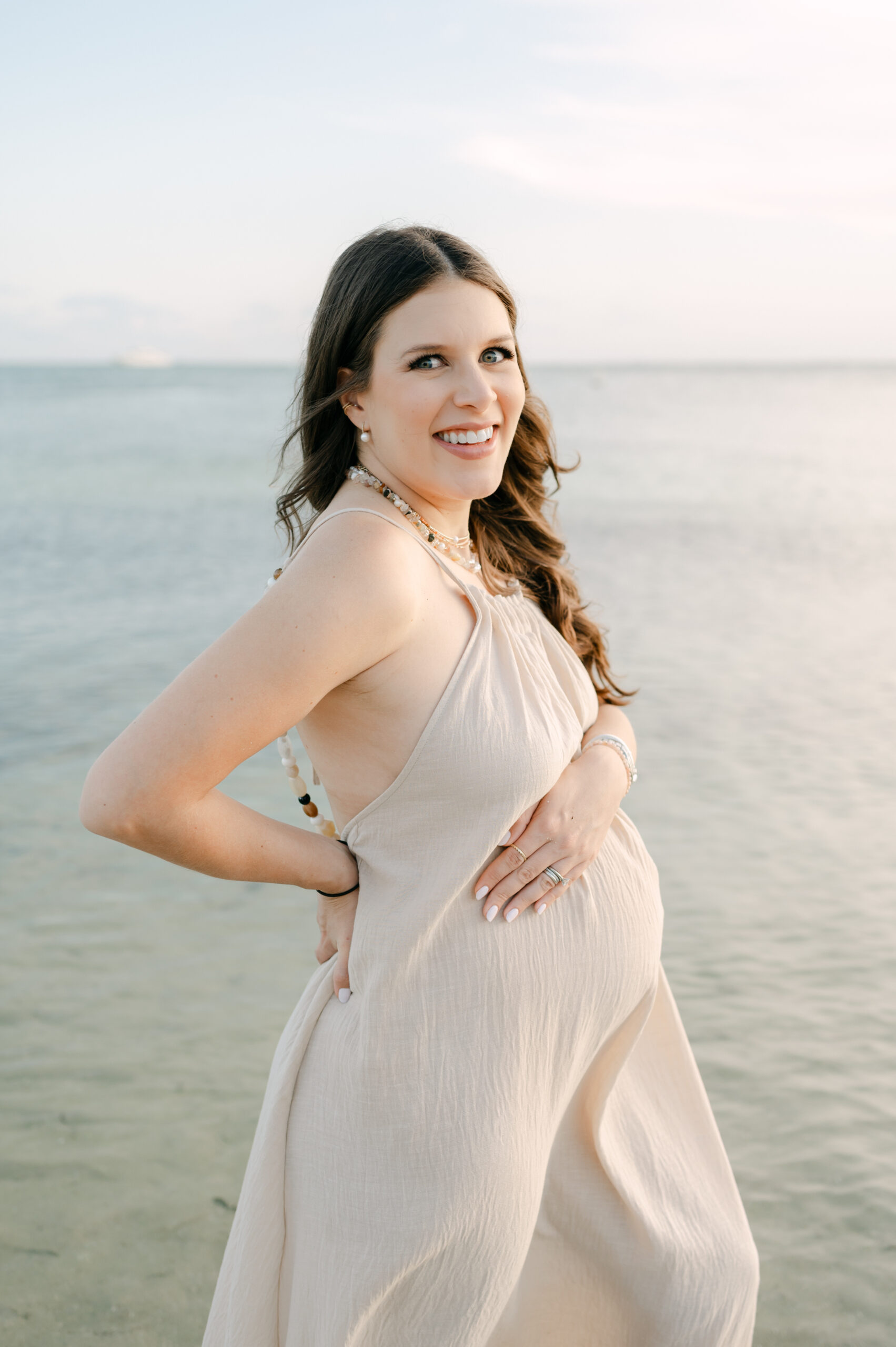 Beautiful pregnant mom at the beach