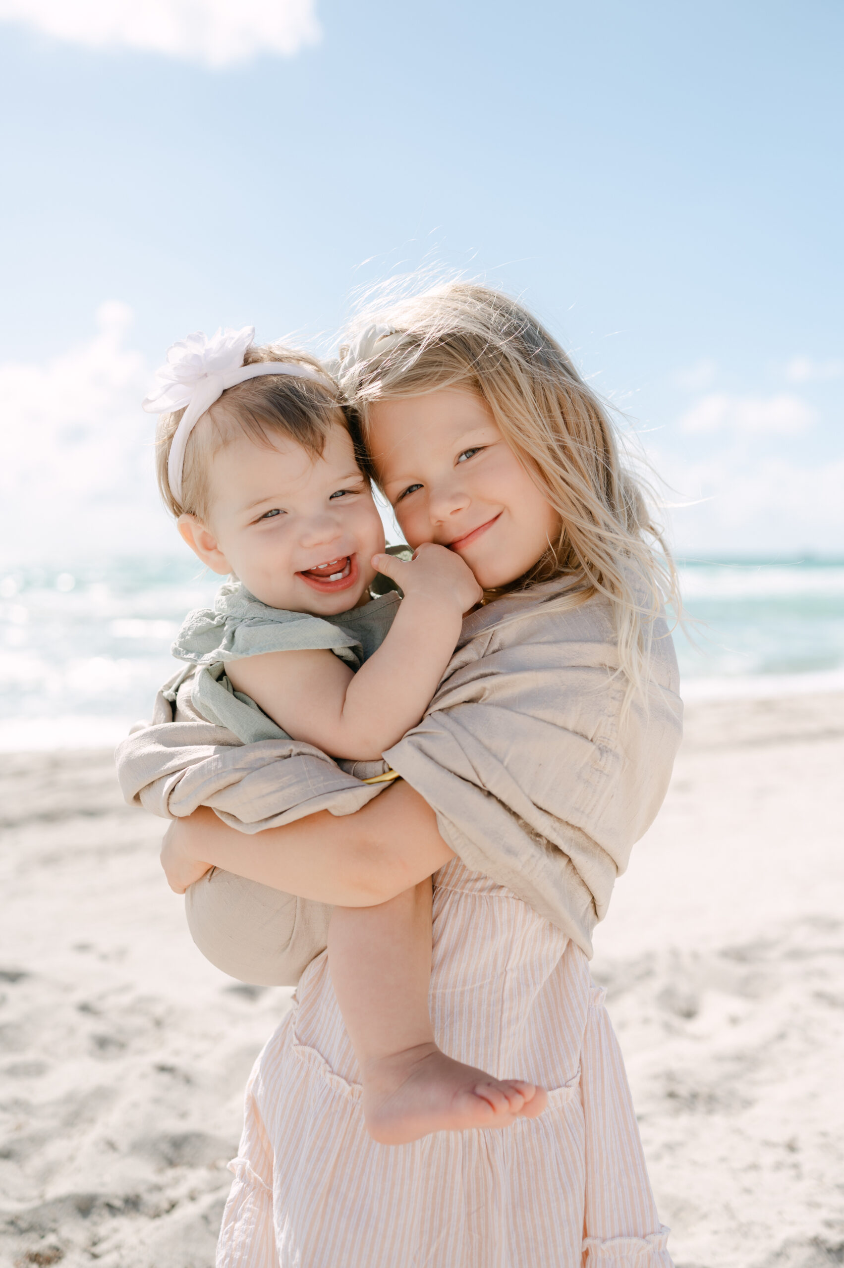 Sisters on the beach during their Miami photoshoot