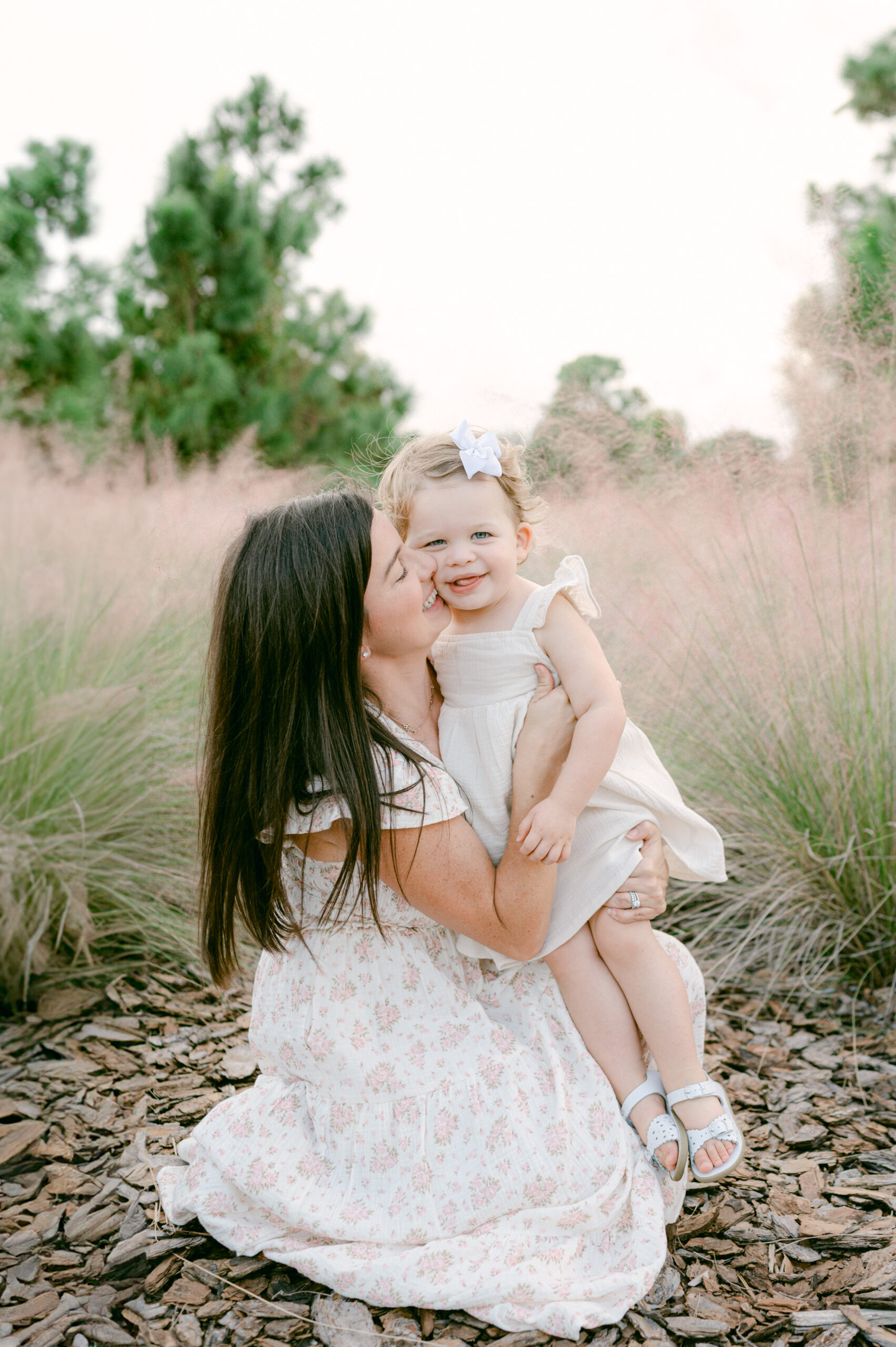 Mom snuggling with her daughter