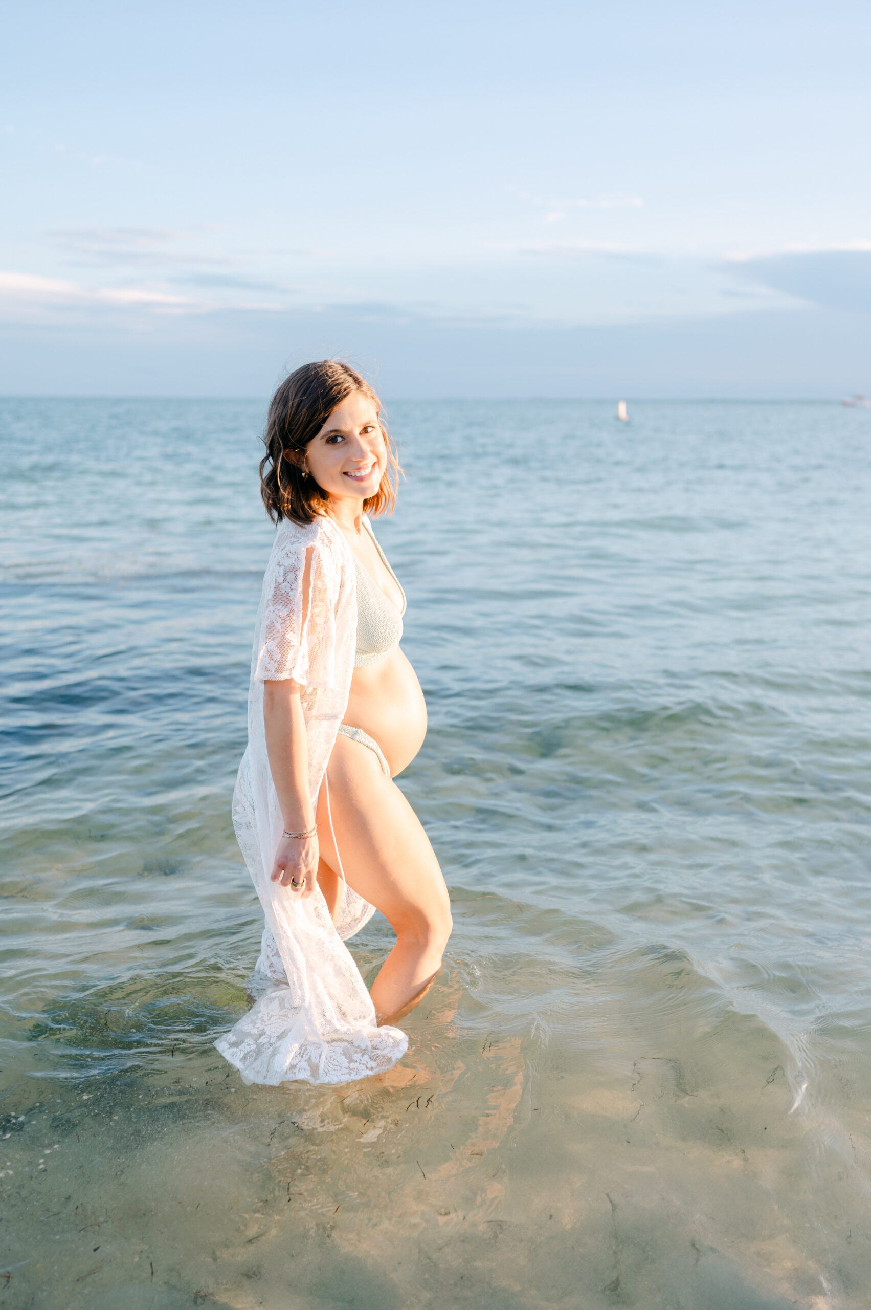 Pregnant mom walking in Miami water