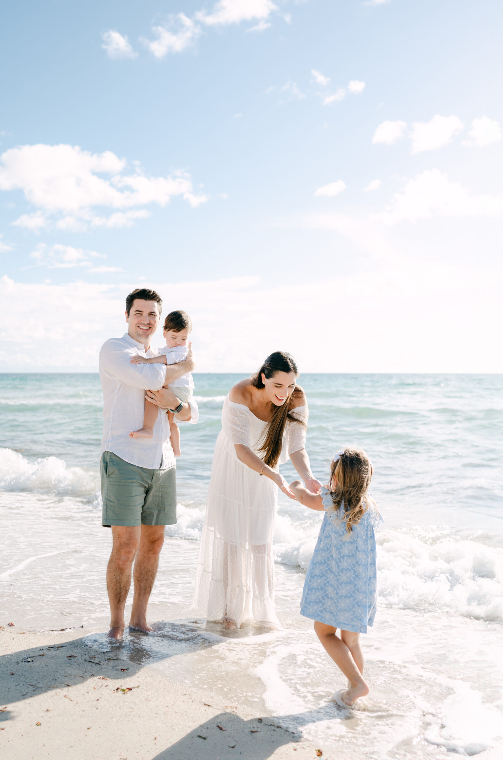 Happy family enjoying time at the beach in South Florida