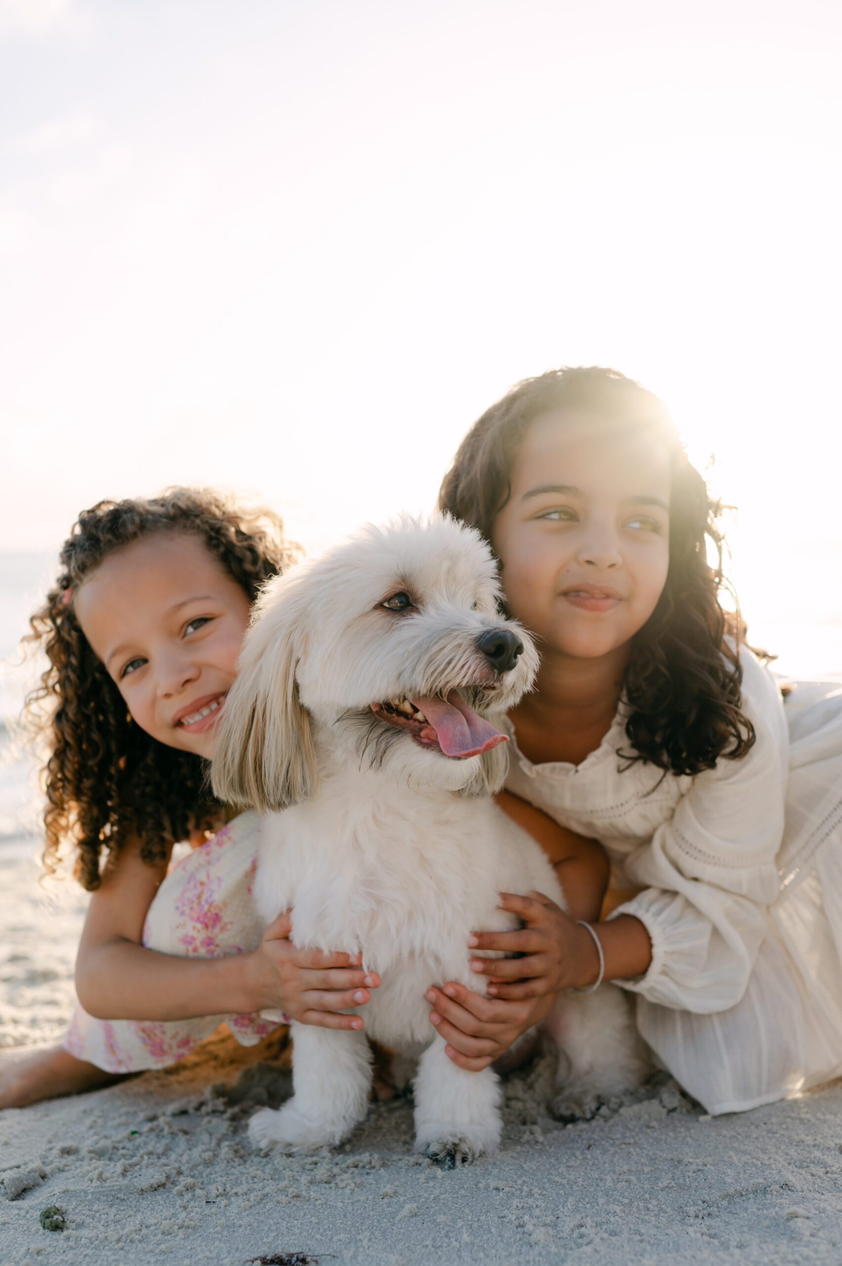 Girls and their dog at the beach