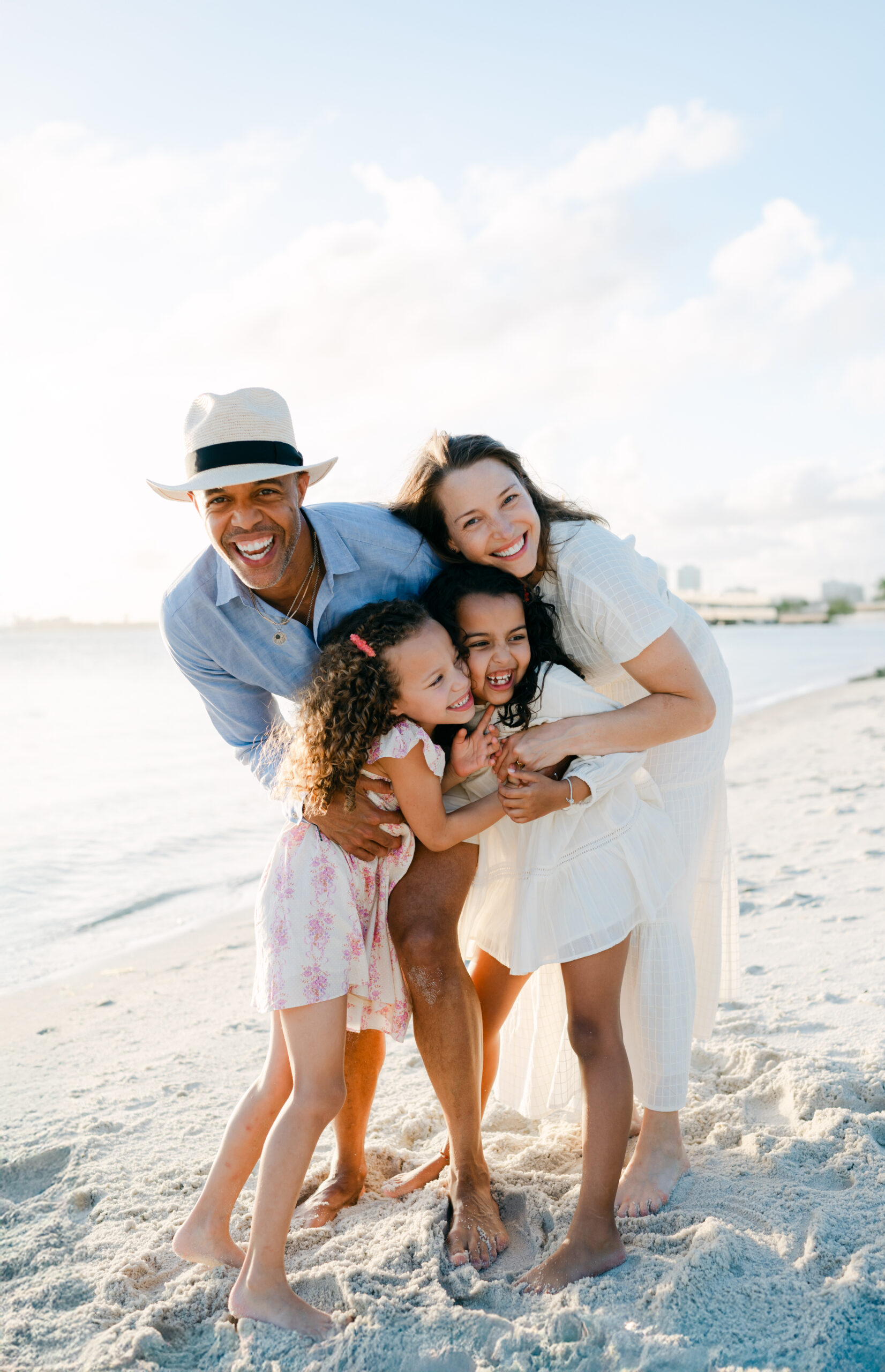 Candid family moments at the beach by Miami family photographer