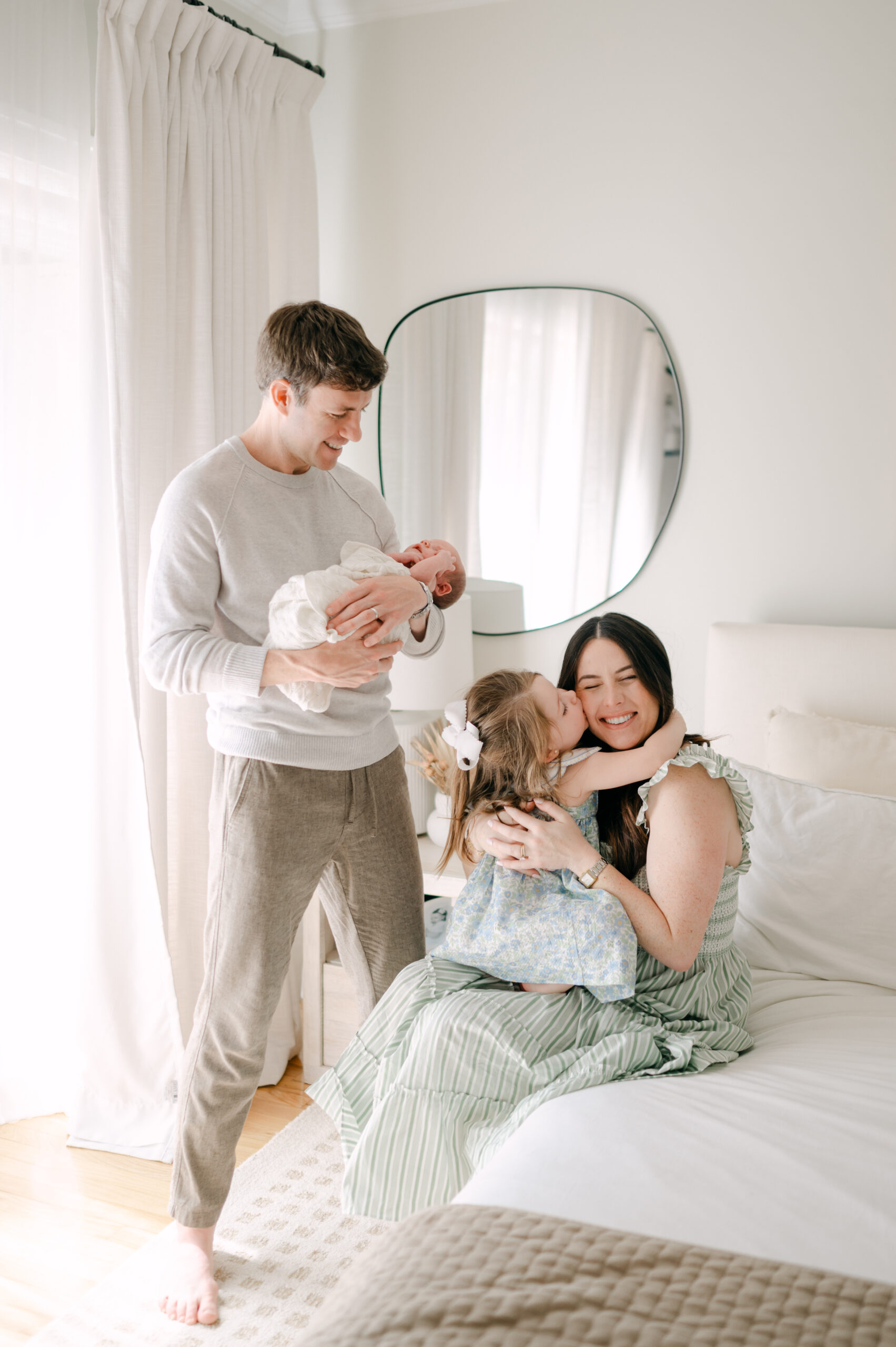 Miami Family laughing together with their newborn and toddler