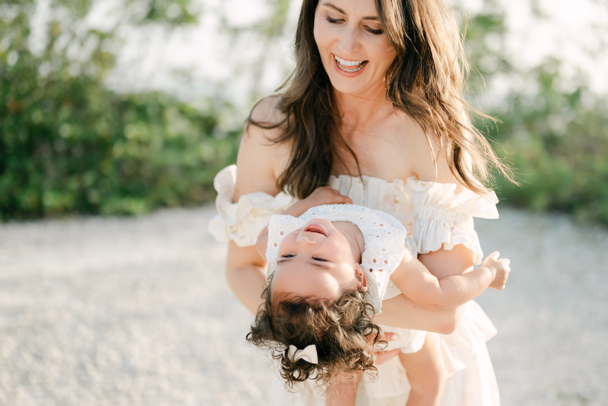 Mom playing with daughter during Miami family photoshoot