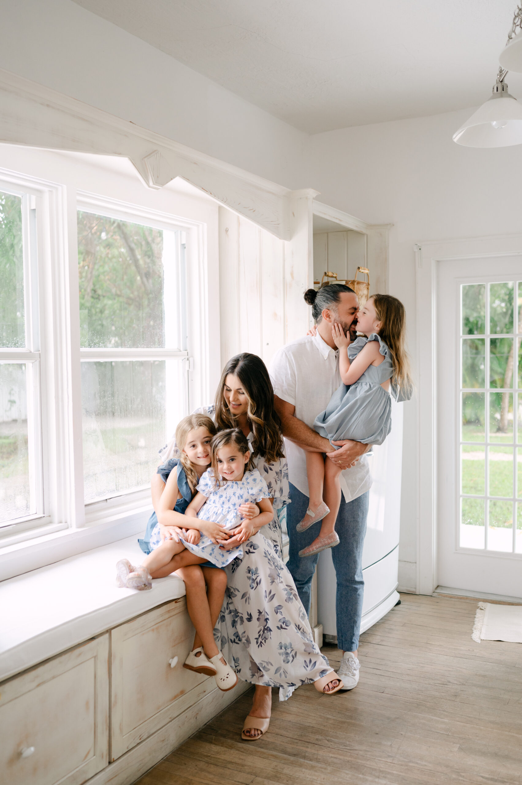 Miami family hugging in cozy home